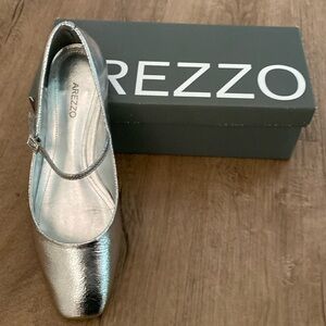 Arezzo silver Mary Jane’s.  Worn once -excellent condition.
